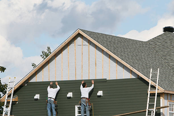 Professional Storm Damage Siding Repair technician working in Stow, MA